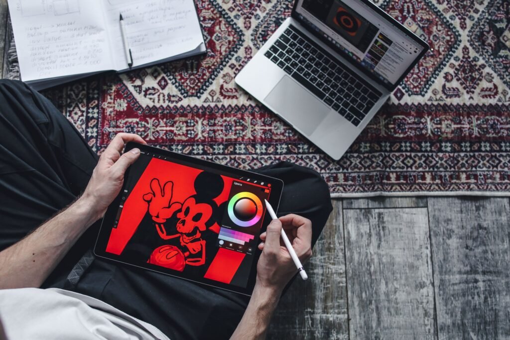 Person drawing on a digital tablet for design work